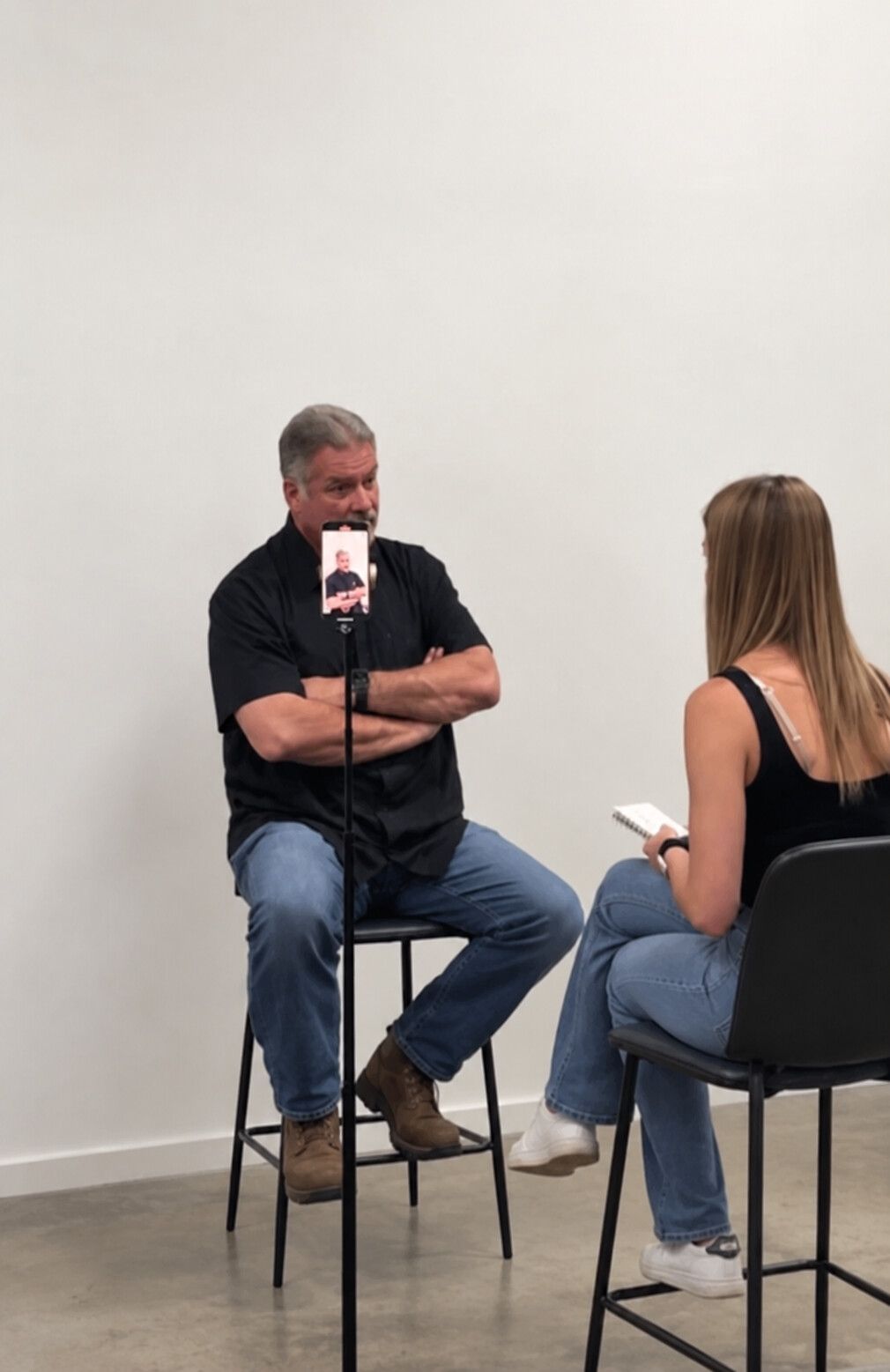 Dylan filming an on-camera interview with a client